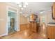 Spacious kitchen with open view to the breakfast room and the screen porch at 322 Bellemont Rd, Pittsboro, NC 27312