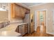 Well-equipped kitchen with stainless steel appliances, light countertops, and a view to the yard at 322 Bellemont Rd, Pittsboro, NC 27312