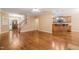 Spacious living room offering seamless flow to kitchen and view of staircase at 322 Bellemont Rd, Pittsboro, NC 27312