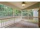 View from a screened in porch with a view of a wooded backyard at 322 Bellemont Rd, Pittsboro, NC 27312