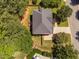 Aerial view of home with fenced backyard, wooded setting, and driveway at 406 Dairy Farm Dr, Hillsborough, NC 27278