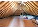 Exposed attic with wood paneling, a ceiling fan and ductwork, offering potential for expansion and storage at 406 Dairy Farm Dr, Hillsborough, NC 27278