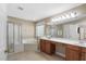 Primary bathroom featuring a soaking tub, glass shower, double sinks, and ample vanity storage at 406 Dairy Farm Dr, Hillsborough, NC 27278