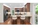 Modern kitchen featuring granite countertops, stainless steel appliances, and breakfast bar seating at 406 Dairy Farm Dr, Hillsborough, NC 27278