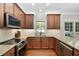 Well-equipped kitchen with granite countertops, stainless steel appliances, and ample cabinet space at 406 Dairy Farm Dr, Hillsborough, NC 27278