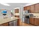 Spacious kitchen with stainless steel appliances, granite countertops, and hardwood floors at 406 Dairy Farm Dr, Hillsborough, NC 27278