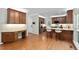 Open-concept kitchen with hardwood floors, granite counters, and stainless-steel appliances at 406 Dairy Farm Dr, Hillsborough, NC 27278
