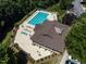 Aerial view of a community pool with lounge chairs, tables, and lush landscaping at 4536 Sugarbend Way, Raleigh, NC 27606