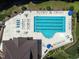 Aerial view of a community pool with lounge chairs and umbrellas at 4536 Sugarbend Way, Raleigh, NC 27606