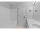 Bathroom featuring a tub shower, single vanity, neutral tile floors, and neutral walls at 4536 Sugarbend Way, Raleigh, NC 27606