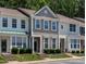 Charming townhome featuring two-story design, neat landscaping, and neutral exterior at 4536 Sugarbend Way, Raleigh, NC 27606