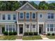 Charming townhome featuring two-story design, neat landscaping, and neutral exterior at 4536 Sugarbend Way, Raleigh, NC 27606
