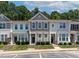 Charming townhome featuring two-story design, neat landscaping, and neutral exterior at 4536 Sugarbend Way, Raleigh, NC 27606