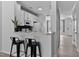 Open-concept kitchen featuring seating at the countertop and stainless steel appliances at 4536 Sugarbend Way, Raleigh, NC 27606