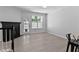 Open-concept living room has light flooring, a fireplace, and plenty of natural light at 4536 Sugarbend Way, Raleigh, NC 27606