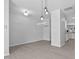 Bright, airy living room featuring wood floors, ample natural light, and modern lighting fixtures at 4536 Sugarbend Way, Raleigh, NC 27606