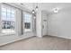 Bright, airy living room featuring wood floors, ample natural light, and modern lighting fixtures at 4536 Sugarbend Way, Raleigh, NC 27606