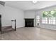 Spacious living room featuring stairs, fireplace, and a backyard door at 4536 Sugarbend Way, Raleigh, NC 27606