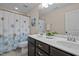 Bathroom with double sinks, white counter and shower curtain at 469 Methven Grove Dr, Cary, NC 27519