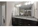 Bathroom with double sinks, granite countertop and large mirror with plenty of lighting at 469 Methven Grove Dr, Cary, NC 27519