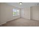 This bedroom offers natural light and neutral paint colors at 469 Methven Grove Dr, Cary, NC 27519