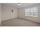 Bedroom with a window and neutral wall color at 469 Methven Grove Dr, Cary, NC 27519