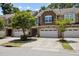 Charming townhome featuring a two-car garage, and beautifully maintained landscaping at 469 Methven Grove Dr, Cary, NC 27519
