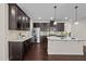 Modern kitchen with granite countertops, stainless appliances, and ample storage at 469 Methven Grove Dr, Cary, NC 27519