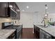 Gourmet kitchen with stainless appliances, granite counters, and a gas range at 469 Methven Grove Dr, Cary, NC 27519