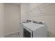 This is a laundry room with a washer and dryer and wire shelving at 469 Methven Grove Dr, Cary, NC 27519