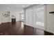 Open living space with fireplace, hardwood floors, and sliding door access to the outdoors at 469 Methven Grove Dr, Cary, NC 27519