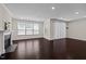 Bright and airy living room with hardwood floors and a modern fireplace at 469 Methven Grove Dr, Cary, NC 27519