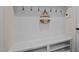 Convenient mudroom featuring bench seating, storage, and hooks for organization at 469 Methven Grove Dr, Cary, NC 27519