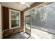 Cozy screened porch with ceiling fan and stone flooring at 469 Methven Grove Dr, Cary, NC 27519