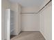 This walk-in closet features neutral colored carpet and shelving at 469 Methven Grove Dr, Cary, NC 27519