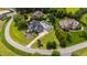 A large estate with a sparkling pool, basketball court, and lush landscaping in a tranquil, upscale neighborhood at 4725 Saratoga Falls Ln, Raleigh, NC 27614