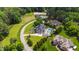 Expansive property featuring a pool, lush landscaping, and proximity to equestrian facilities, offering luxury and privacy at 4725 Saratoga Falls Ln, Raleigh, NC 27614
