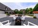 A stunning outdoor space offers an inground pool, a fire pit, and comfortable seating areas at 4725 Saratoga Falls Ln, Raleigh, NC 27614