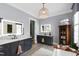 Bathroom with and sink vanities with modern lighting, a neutral color palette and stylish fixtures at 4725 Saratoga Falls Ln, Raleigh, NC 27614