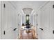 Spacious entryway features views into the home, a patterned ceiling, decorative rug, and hardwood floors at 4725 Saratoga Falls Ln, Raleigh, NC 27614