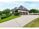 A well manicured lawn and driveway leads to this home's spacious three car garage at 4725 Saratoga Falls Ln, Raleigh, NC 27614