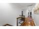 Upstairs hallway with hardwood floors and classic design at 4725 Saratoga Falls Ln, Raleigh, NC 27614