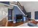 Spacious living room with hardwood floors and a staircase at 4725 Saratoga Falls Ln, Raleigh, NC 27614
