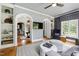 Well-appointed living room featuring built-in shelves, archways, and a cohesive blend of furniture at 4725 Saratoga Falls Ln, Raleigh, NC 27614