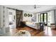 Comfortable main bedroom with stylish decor, barn door to bath, and a cozy sitting area at 4725 Saratoga Falls Ln, Raleigh, NC 27614