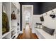 Mudroom features built-in storage, a bench, and hall tree, with views to the kitchen at 4725 Saratoga Falls Ln, Raleigh, NC 27614