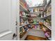 Well-organized pantry with ample shelving and storage for food and household items, creating a tidy space at 4725 Saratoga Falls Ln, Raleigh, NC 27614