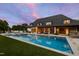 Backyard view with a sparkling pool, manicured lawn, outdoor seating, and a pergola at 4725 Saratoga Falls Ln, Raleigh, NC 27614