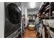 Spacious walk-in closet with custom shelving, hanging racks, and hardwood flooring at 4725 Saratoga Falls Ln, Raleigh, NC 27614