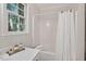 Clean bathroom showcasing a shower-tub combination and a classic vanity setup at 4816 Marlborough Way, Durham, NC 27713